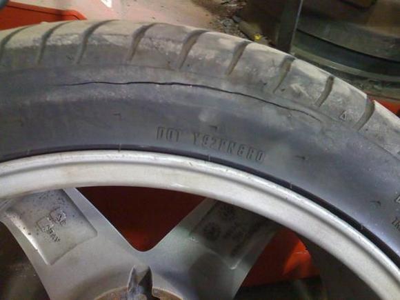 2009 6 3 (1) Bad Riken front tires which I spotted when doing my brakes.  Inside sidewall cracking.  Who installs walmart tires on this car?