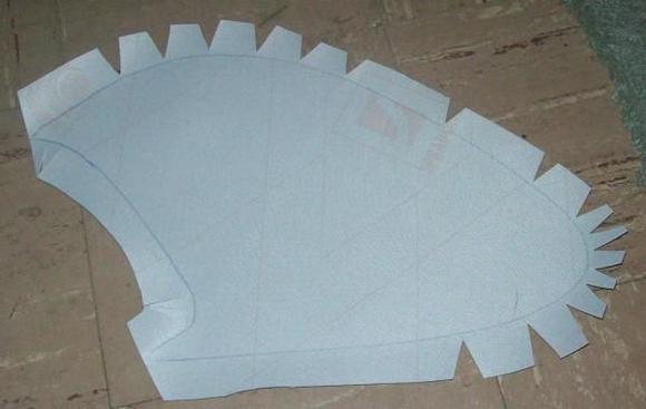 Cut bird-beaks and slits where the vinyl will be curved