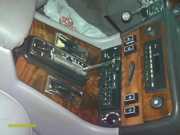 After regluing and refinishing the console wood, not perfect but still original and much better than before.