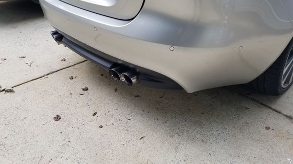 This gives you an idea. I had the existing rear diffuser modded to fit the quad tips and i had it painted a glossier (but not gloss) black
