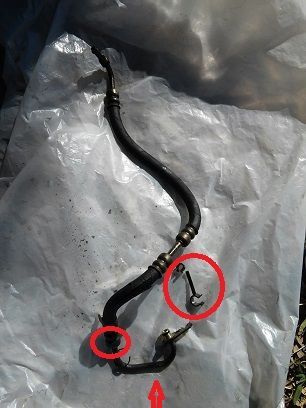 Big circle line to trans line I think as mine was hanging loose. Small circle where you will see tie wrap. Arrow where there was a special electric to metal line clip that was taped to electrical. Didn't reuse any of these. Used two tie wraps to line to secure electrical.