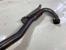 Removing exhaust and checking condition of seals/ gaskets etc. anyone know if this is a stock head pipe? It’s connected to an FMF Q4. Not sure if it’s a full system or just a slip on. By the way , head pipe to slip on had no clamp or sealant, just friction fit....Thanks