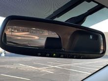 Auto-dimming rearview with compass and HomeLink.