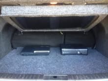 Trunk of my car showing Sony HD 3D  TV in the up position as well as PS3 and 360