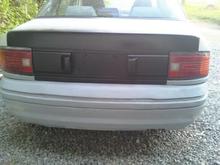 Changed out the center license plate area on the trunk for the 1990 one and painted it all satin black! Looks nicer in my eyes