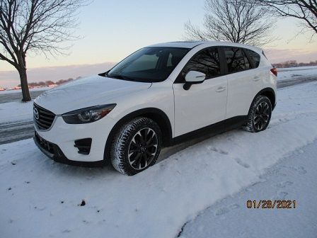 2016.5 CX-5 AWD, front quarter view.