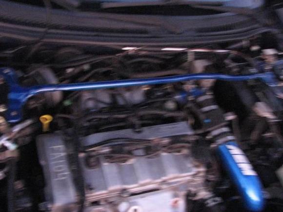 engine photo 4 cyl. 2.0 liter cold air.muffler,and a body kit by h&amp;r racing.and after market strut bar