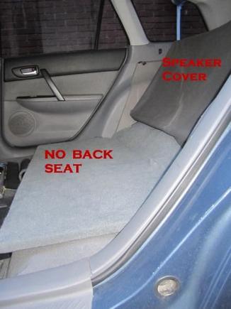 No Back Seat. Carpeted wood bolted where seat goes with 90 degree large brackets.