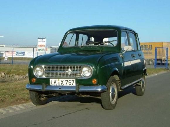Renault 4 (not our actual car)
Hunter green, like our first family car. Three of us learned how to drive with this. You think this is ugly? Make a Google search for "Citroen Ami 6". That car defines ugly. Renault set out to build a car that will transport 4 adults in comfort for as little money as possible. All windows are of flat glass. The side windows are sliders. 4 door hatchback. The wheels have only 3 studs. The engine was taken from the venerable Dauphine and put up front, gearbox in front of it, driving the front wheels. But: 4 wheel independent suspension with extreme wheel travel. It created some scary lean angles in the corners. One year we traveled over the Alps to Slovenia.