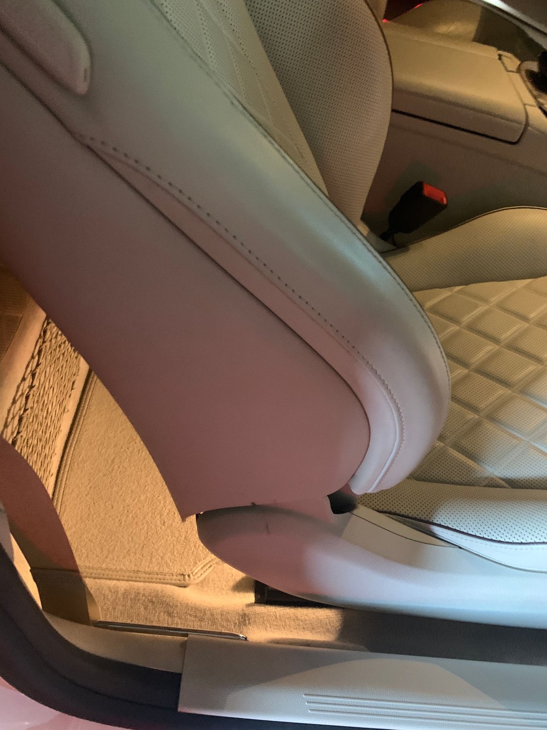 The passenger seat is retracted into the shell, avoiding exposure of the side fabric.