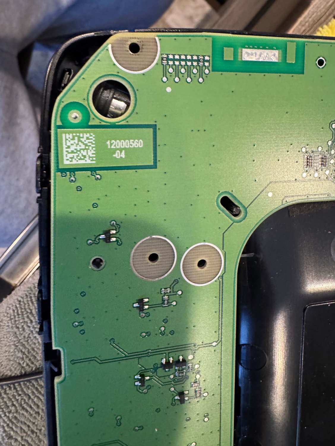 You can see the mic is secured once you lay the circuit board down.  A plastic peg supposed to go though the hole in the pic. So you will need to shave it down.