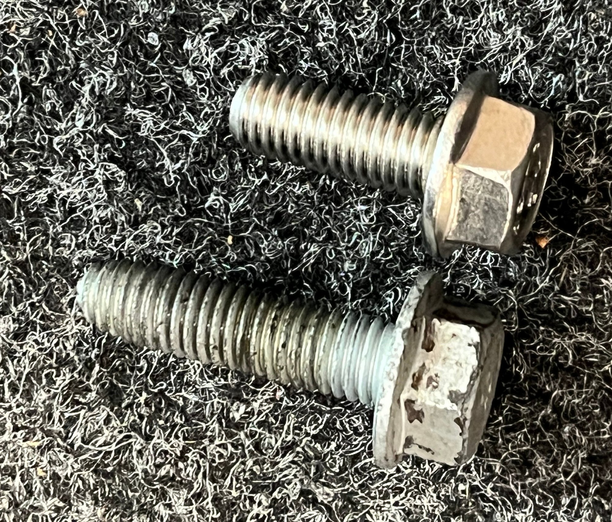 Shorter M8x1.25 20mm flanged hex head SS bolt.
