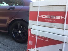 Stack of Vossen Tims in boxes next to my 2010 w204.