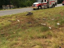 Engine, transmission, and drive shaft were thrown from the chassis and landed on the other side of the median.