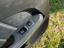 Factory rear seat heating button installed in original location.  The wiring shown earlier replaced the original wiring in the door panel.  The control module will be installed in the door panel