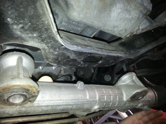 Here is what the steering linkage looks like without the cover. It is loose and you can pull it down. Be advised that it is a pita to align the bolt holes back in place To resecure the linkage.
