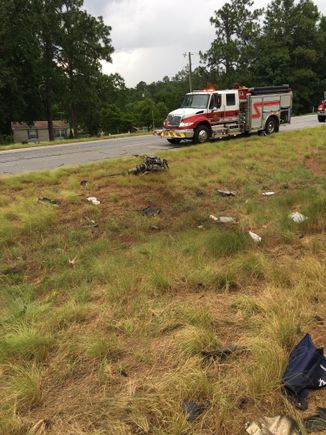 Engine, transmission, and drive shaft were thrown from the chassis and landed on the other side of the median.