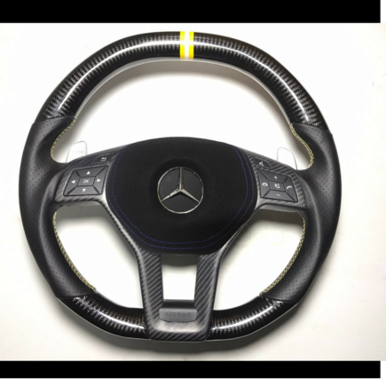 Carbon Fiber gloss finish with double yellow and white chapter ring 'tri ring'
Perforated leather with yellow and white cross stitching.
Matte/Glossy central carbon trim piece option
Airbag cover in in alcantara trim option