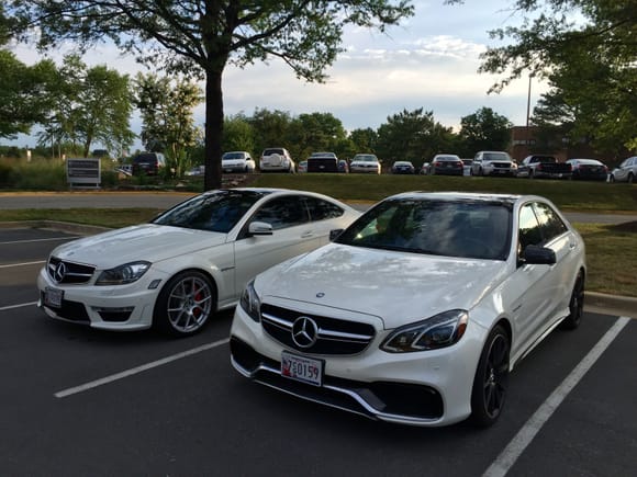 My C63 and my buddy's E63s in the parking lot at work.