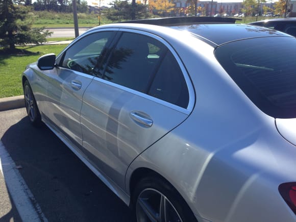 Costco parking lot in full  sun.  The tint is all windows and front and rear windshields.