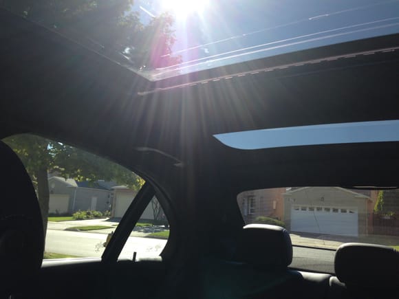 View of Panoramic Roof and window tint as comparison.  Full sunlight as you can see