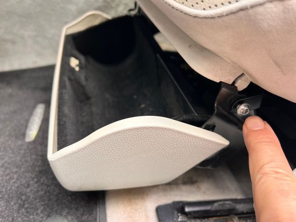 First start by removing the storage bin. It’s super easy with only two screws to remove, one on the outside and one on the inside by the center console. 