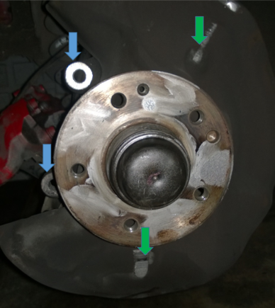 Pic4: Blue identifies caliper mounts.  Easiest point to machine, but could ruin axle toe and alignment?  Also notice the rotor was rubbing dust plate