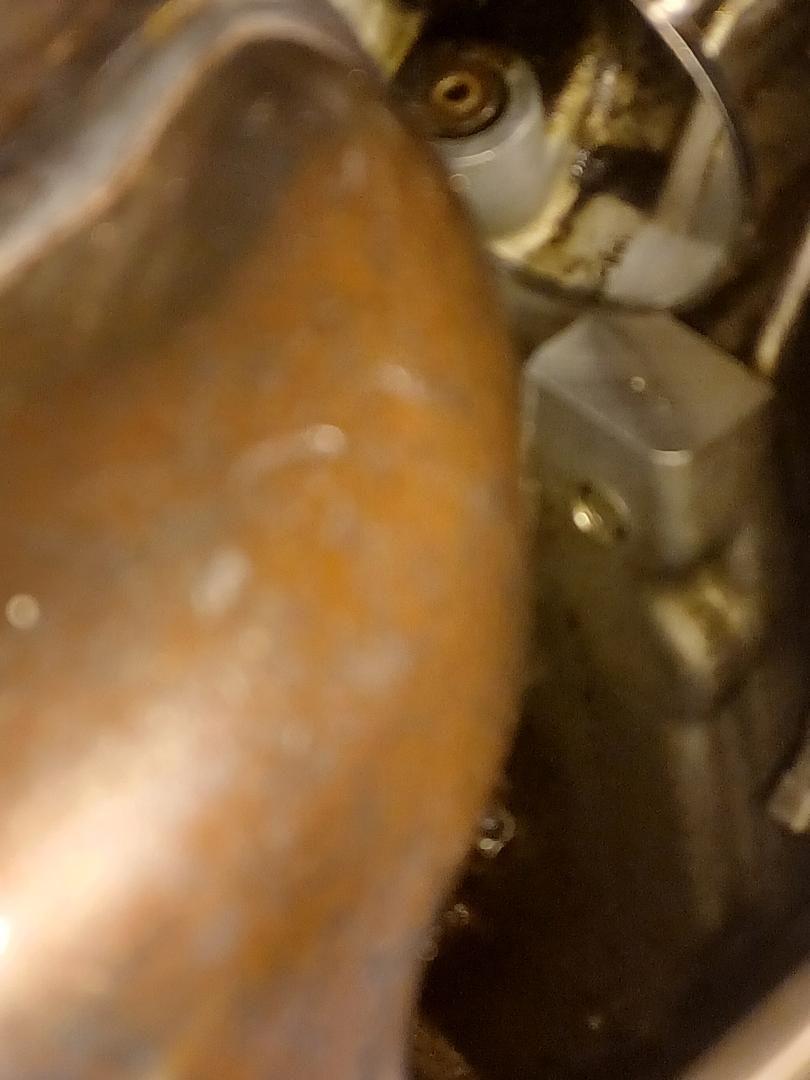 The part in question is just in front of, and below the exhaust manifold (foreground). upper center of the picture.