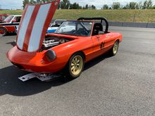 One of my paddock neighbors.  Italian roadster in it's natural state, leaking oil onto the pavement.