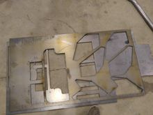 Plasma cut mounting plates out of 0.25" plate. Only 0.080" was required, but with all of the removed material and a little FEA, we decided to overkill these plates to increase the stiffness of the tub.