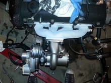 Turbo install trial fit, still need an exhaust manifold gasket. Check out the valve cover/turbo contrast!