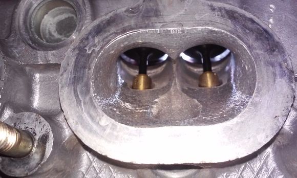 How would you treat the deep gouges/casting flaws on the high side radius ? Smoothing them would direct flow into the back of the valve. I've never epoxyed in the bowl area and I don't know if it'd hold this near to the seat (due to heat?). To weld up, you'd need to remove the seats. What have you done in this area?