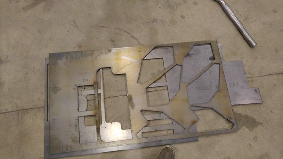 Plasma cut mounting plates out of 0.25" plate. Only 0.080" was required, but with all of the removed material and a little FEA, we decided to overkill these plates to increase the stiffness of the tub.