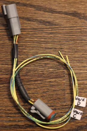 Sequential ignition sub-harness. This plugs inline to the main sub-harness, and you wire back to optional outputs on your ECU to run sequential ignition. 