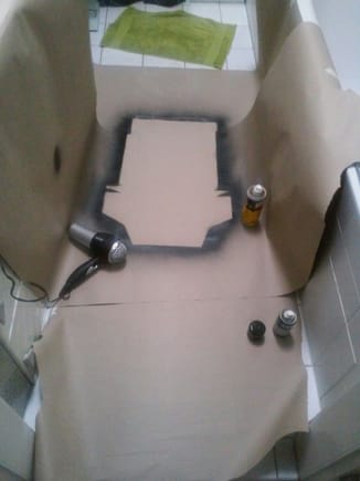 setting up the paint booth in the tiniest bathroom in the world. the rest of the seat would get dyed black later.