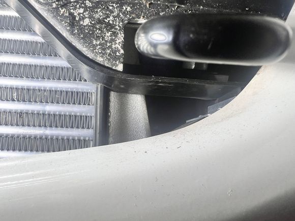 Gap along side intercooler under tow hooks.