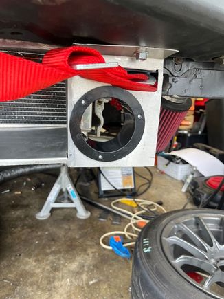 The other side is nearly identical, but has the inlet moved up due since there's no tow strap/hook in the way. 