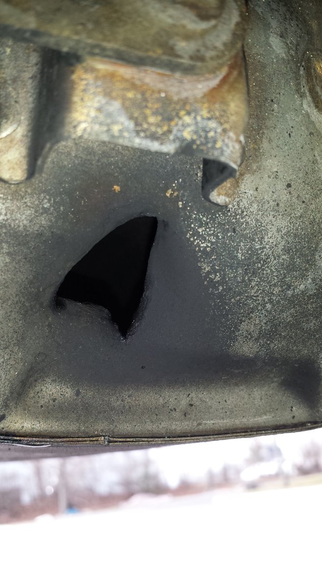 An odd hole on the OEM muffler. MyG37