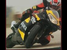 I've done the speed cycle racing. It is such a weird feeling at first. The first time you kick that tire out, and lean out, man it is just awesome! The picture is obviously not from a speed way race, but how neat is that shot?