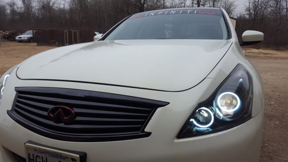 Installed a windshield decal/sun strip visor and customized my infinti emblem with 3m red tape