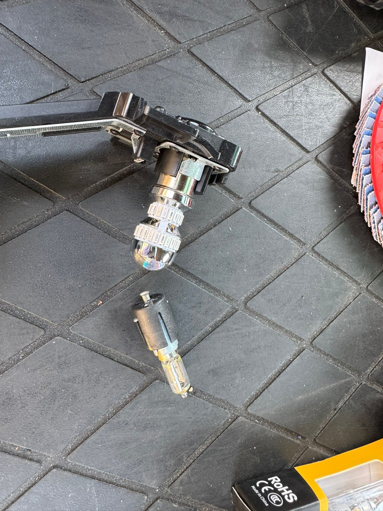 The 1156 plug-n-play LED bulb mounted into the tail light bulb carrier. A perfect fit.