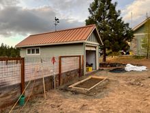 concrete pad for the propane tank feeding the barn's radiant heat boiler; next to it is a new yard hydrant I sunk to serve the small fenced garden