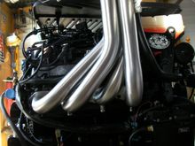 on the starboard side, it's a total mess
the hoses won't work at all. the tube will only work if it's plumbed in backwards because of the cool fuel.
no big deal, the stock hose is no where near the end of the tube. 