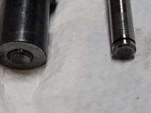 Original pin on left