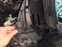 Remove this nut and lift hood into (service) position.