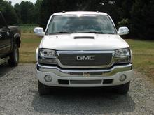 Suncoast heat extractor functional ram air hood, Halo headlights, clear running light lenses, billet grill insert, billet grills for air dam and bumper, painted GMC emblem white, painted mirrors white, chrome mirror caps, and 5% tint strip.