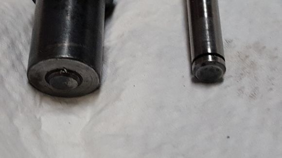 Original pin on left