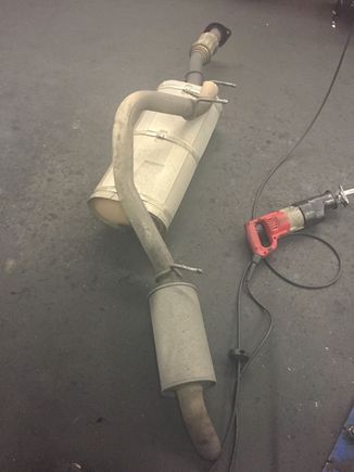 Removed the stock exhaust....started to have a slight rattle to it.... Time to go