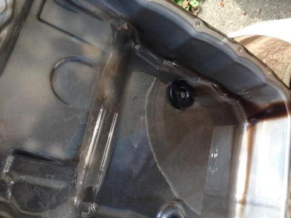 6L80 Transmission pan after drain over 100K miles. 125 shot nitrous caused stock converter to slip.