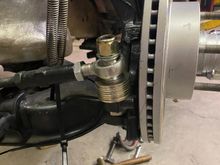 The toe was changing 1/4" or more, from up to down of the spindle. Raising the pivot point of the outer tie rod, took care of it. Now the toe changes less than 1/32" over 7" of travel.